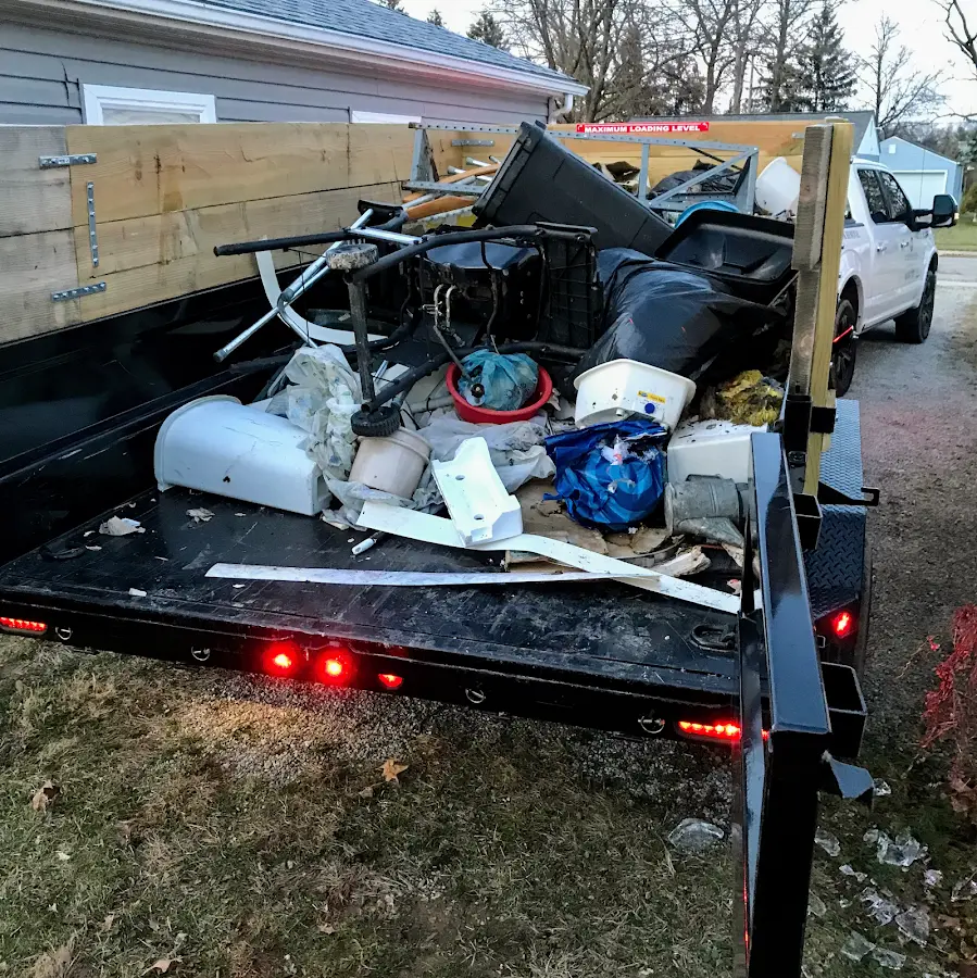 Roll-off dumpster delivered to a residential driveway in Nassau